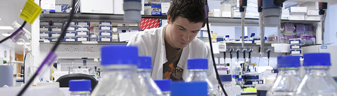 Researcher conducting experiment in the lab